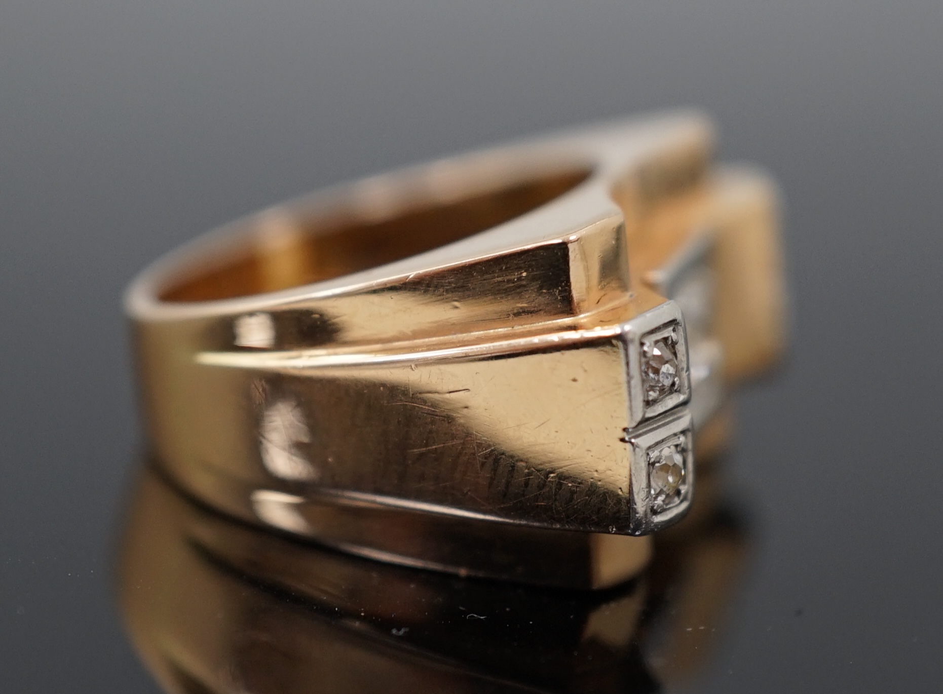 A 1940's 18ct gold and four stone diamond set 'tank' dress ring